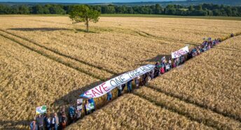 Aerial view of protestors at the proposed solar farm site at One Tree Hill, Potterne