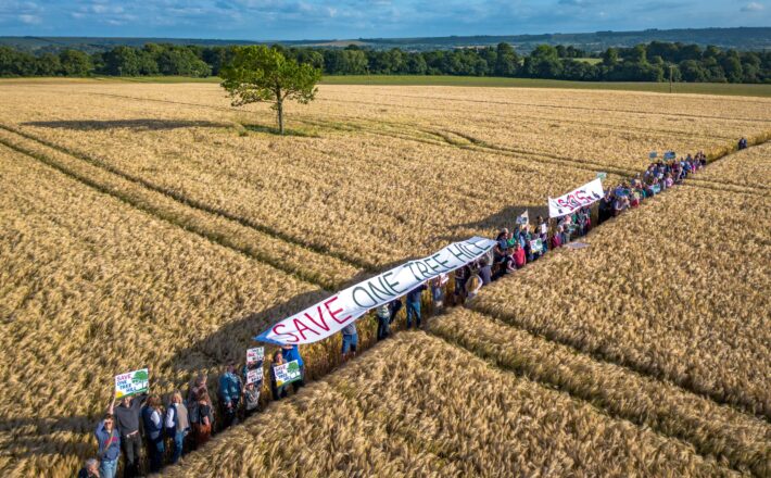 Aerial view of protestors at the proposed solar farm site at One Tree Hill, Potterne