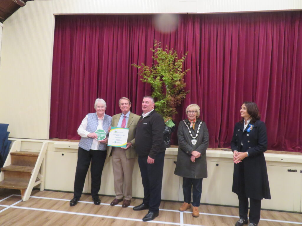 Mr Paul Ashman, Community Engagement Manager for idverde, presents his company’s plaque to Elaine and Paul Bancroft who are proactive villagers in Urchfont. They are watched by Dr Olivia Chapple OBE EMH, High Sheriff of Wiltshire, and Cllr Bridget Wayman, Chairman of Wiltshire Council.